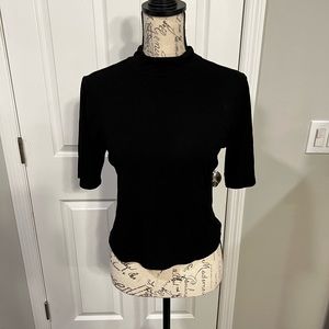 An open back black top